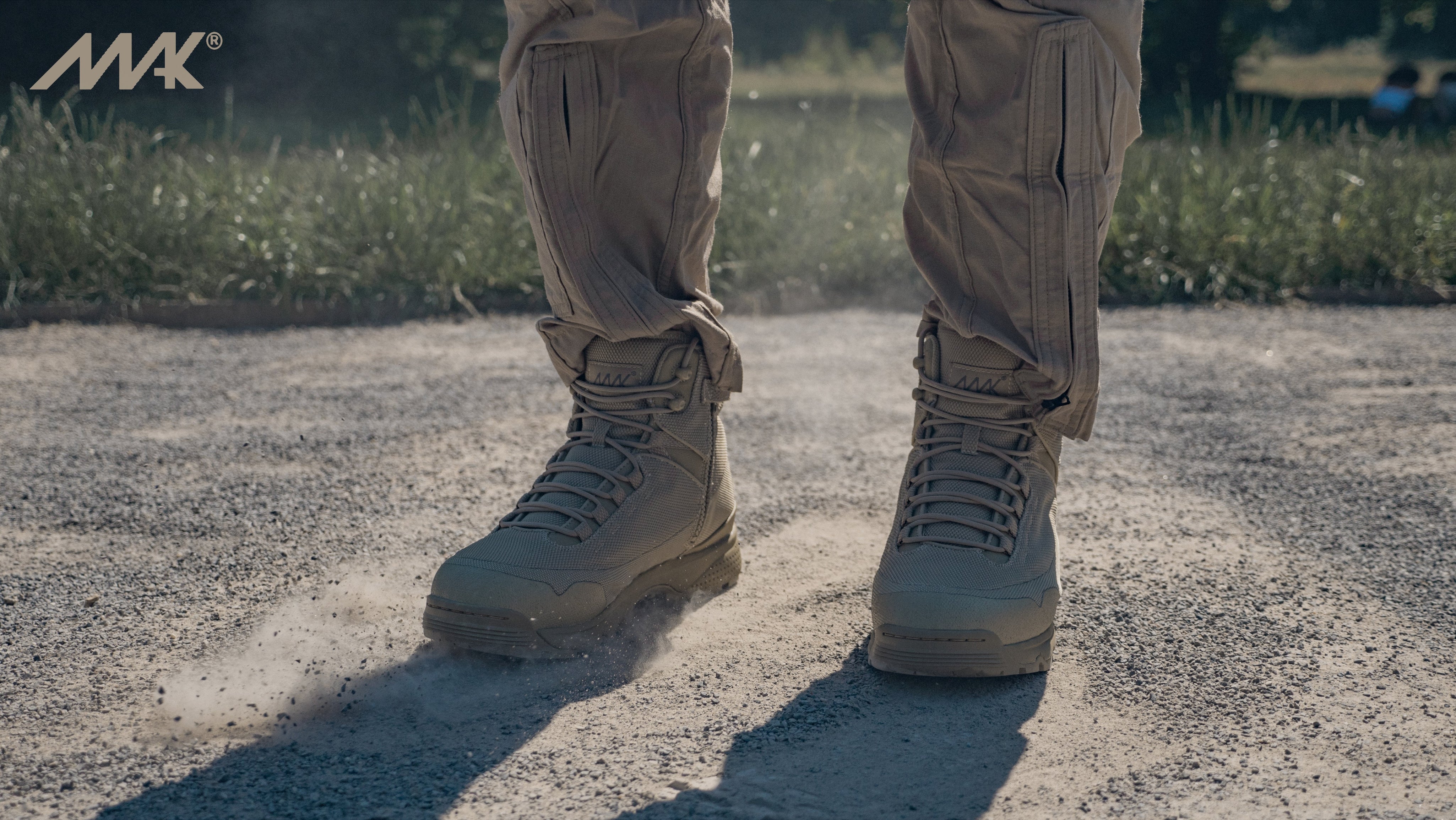desert tan military combat boots stomping on ground