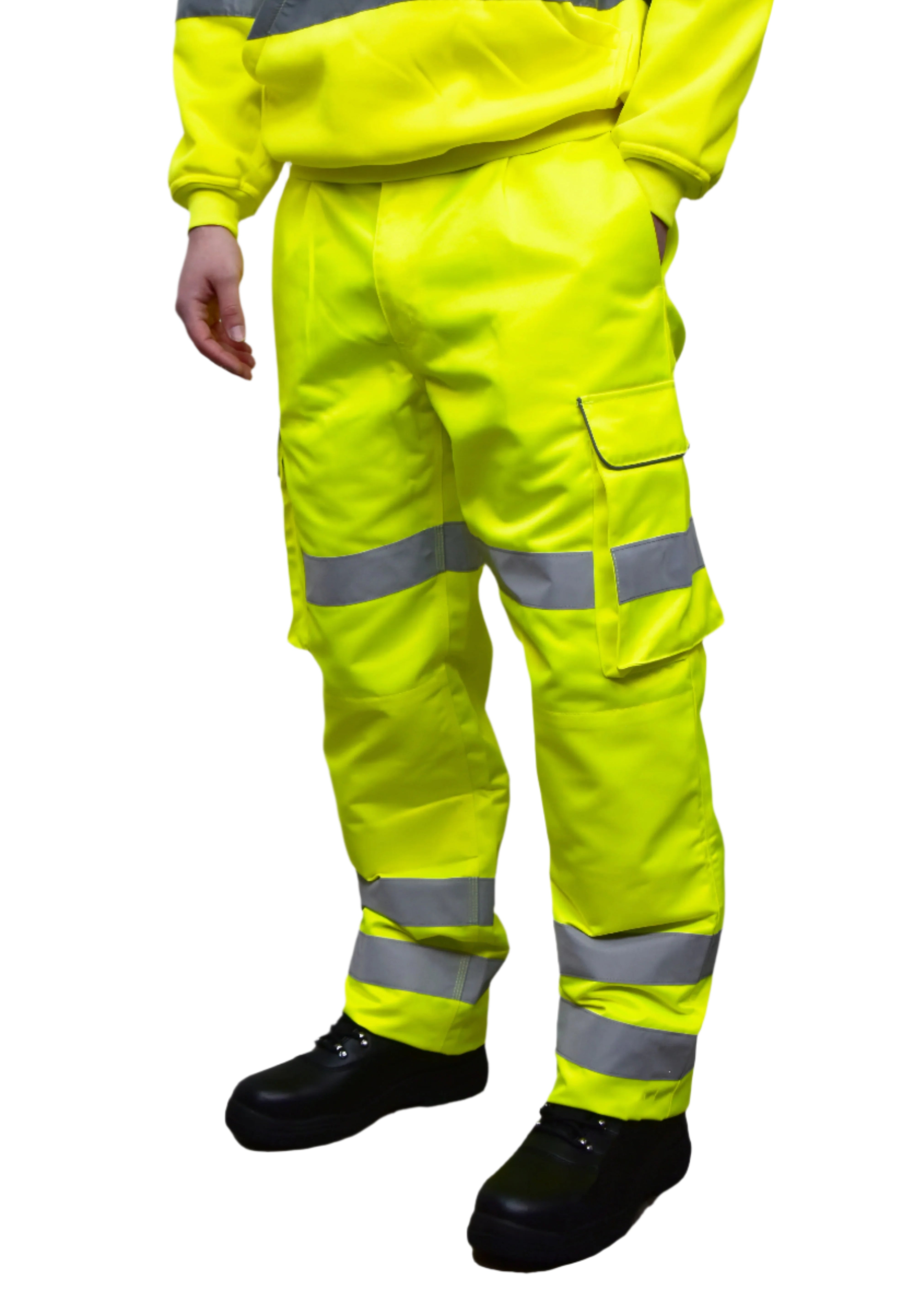 A person wearing high-visibility yellow work trousers with reflective grey stripes around the knees, shins, and thighs. The pants have a cargo pocket on the side and are paired with black safety boots. Only the lower half of the person is visible. The trousers appear to be part of a workwear or safety uniform. by MAK Boots & Garments