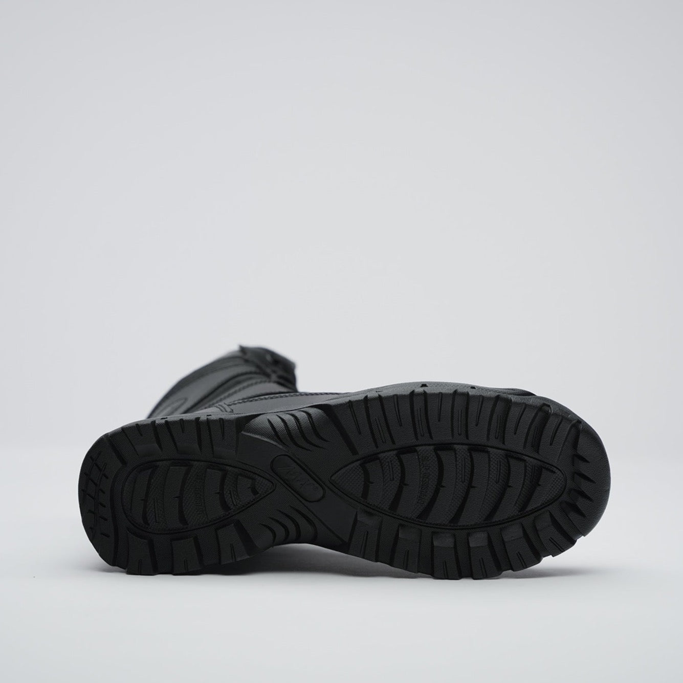 view of rubber sole with mak logo and slip resistance
