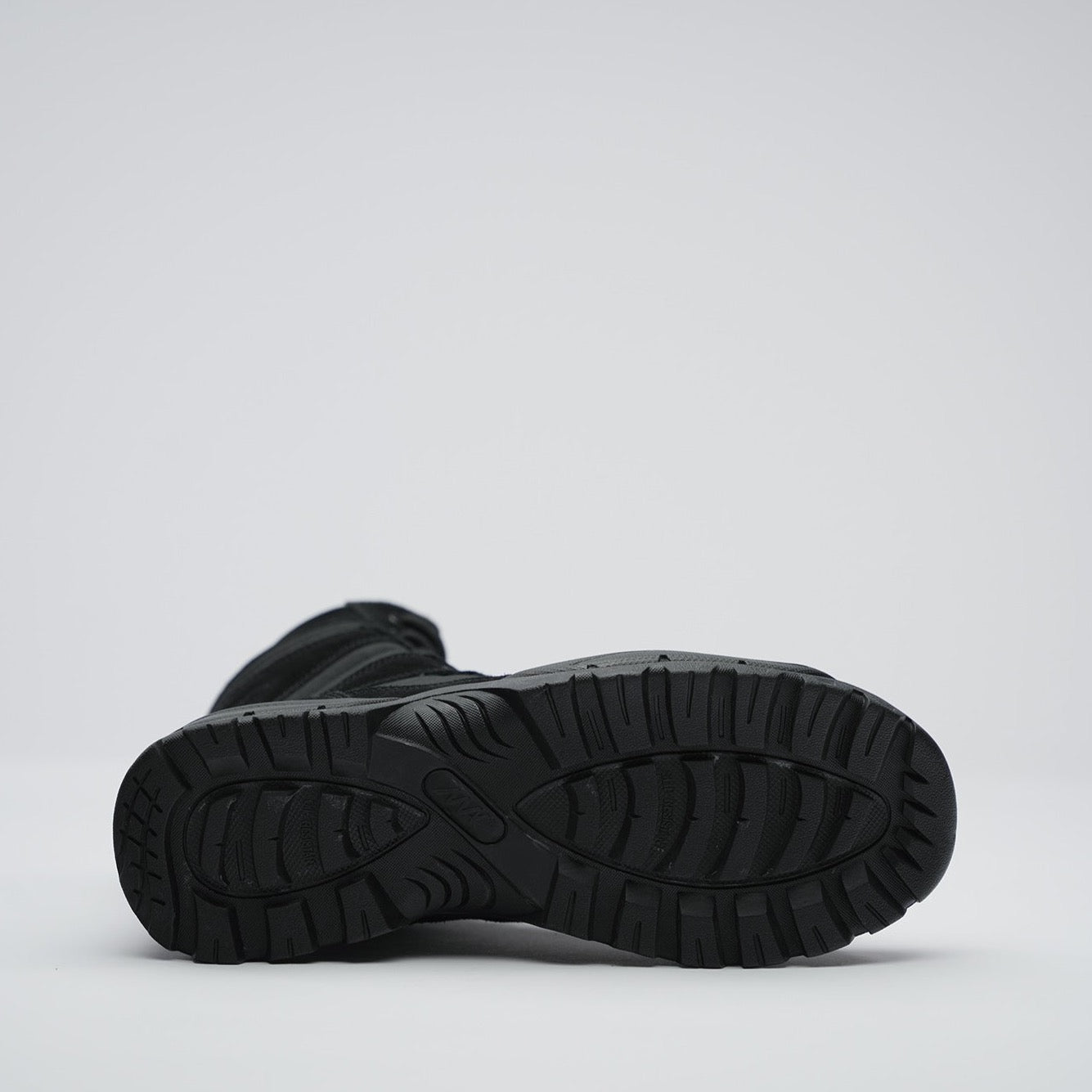 view of rubber sole with mak logo in the middle and slip resistant sole