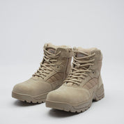 pair of desert tan military boots with lace fastening