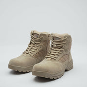 pair of desert tan military boots with lace fastening