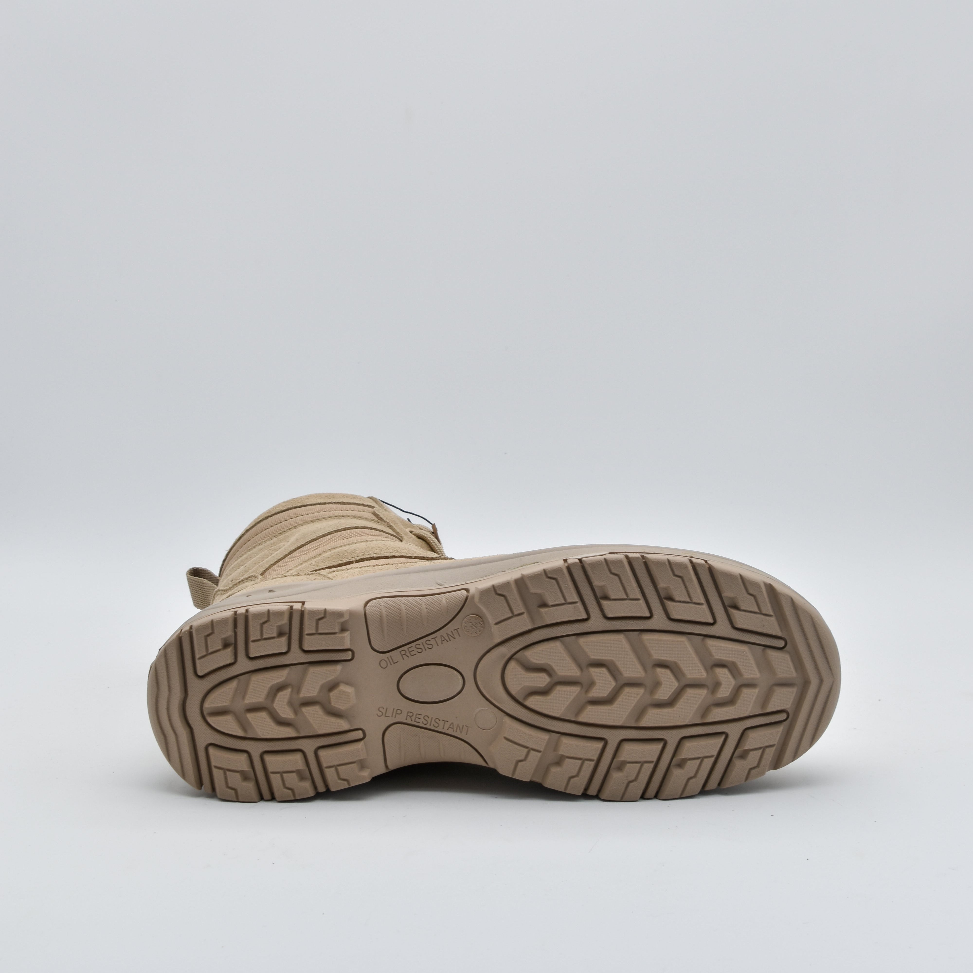 A single tan tactical boot shown from a rear three-quarter view, highlighting its textured rubber outsole tread against a light gray studio background.