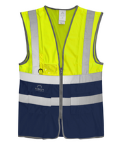 High-visibility two-tone safety vest in fluorescent yellow and navy blue with silver reflective striping, ID holder, D-ring attachment, and multiple utility pockets.
by MAK Boots & Garments