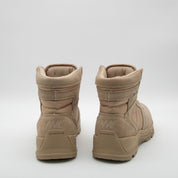 Pair of tan boots on a white background