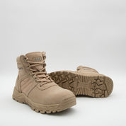 Tan tactical boots on a white background