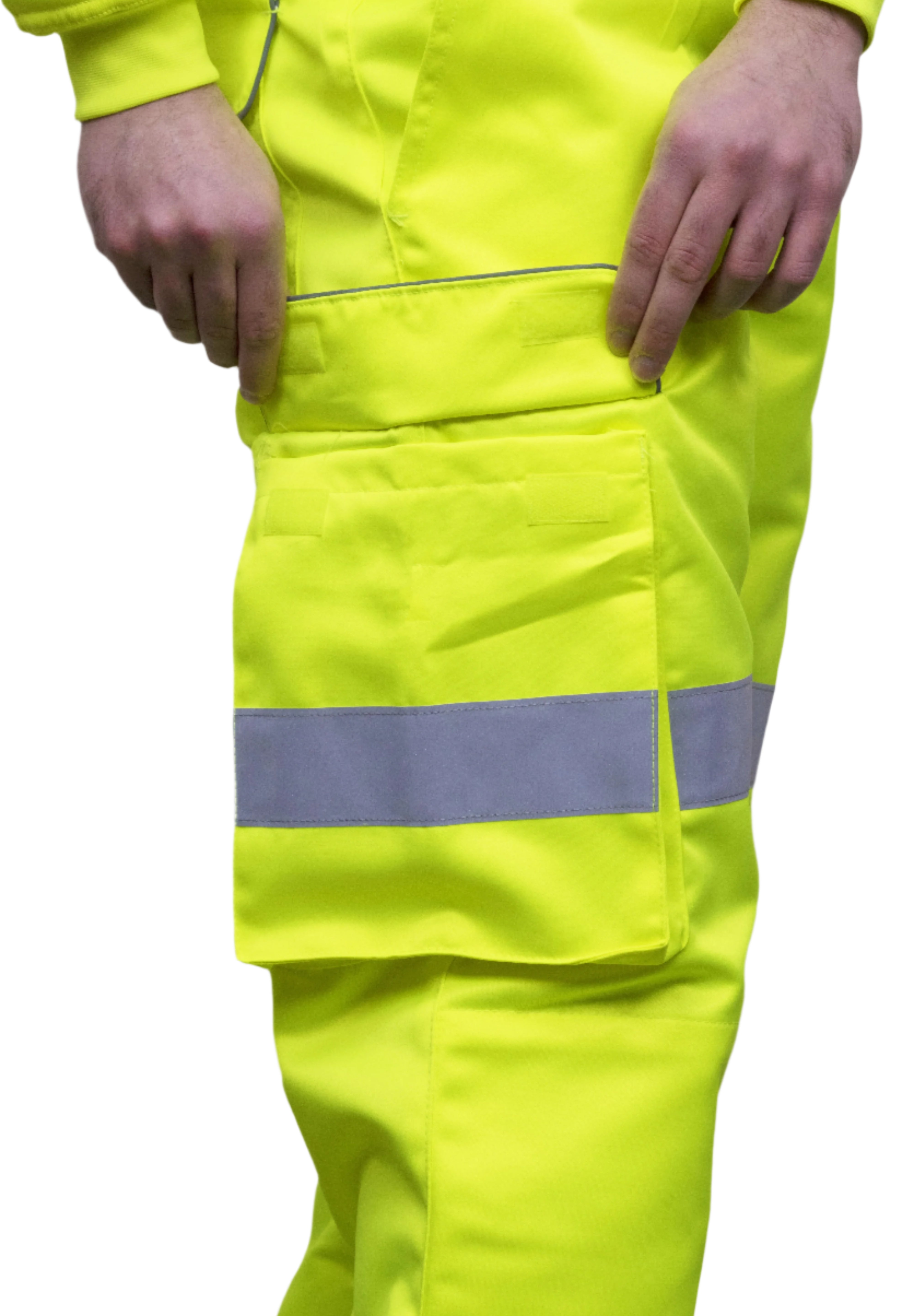 A person wearing high-visibility yellow work trousers with reflective grey stripes around the knees, shins, and thighs. The pants have a cargo pocket on the side and are paired with black safety boots. Only the lower half of the person is visible. The trousers appear to be part of a workwear or safety uniform. by MAK Boots & Garments
