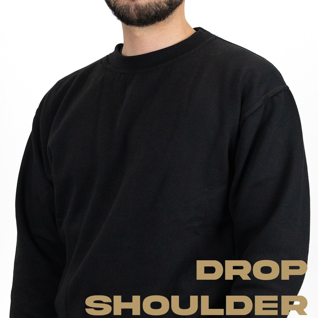 close up shot of black work jumper showing drop shoulder fit