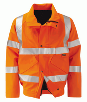 High visibility orange GORE-TEX waterproof jacket with reflective tape across shoulders, arms, chest, and waist. Features multiple storm pockets, front zip with storm flap, and durable weather protection for industrial or railway environments.