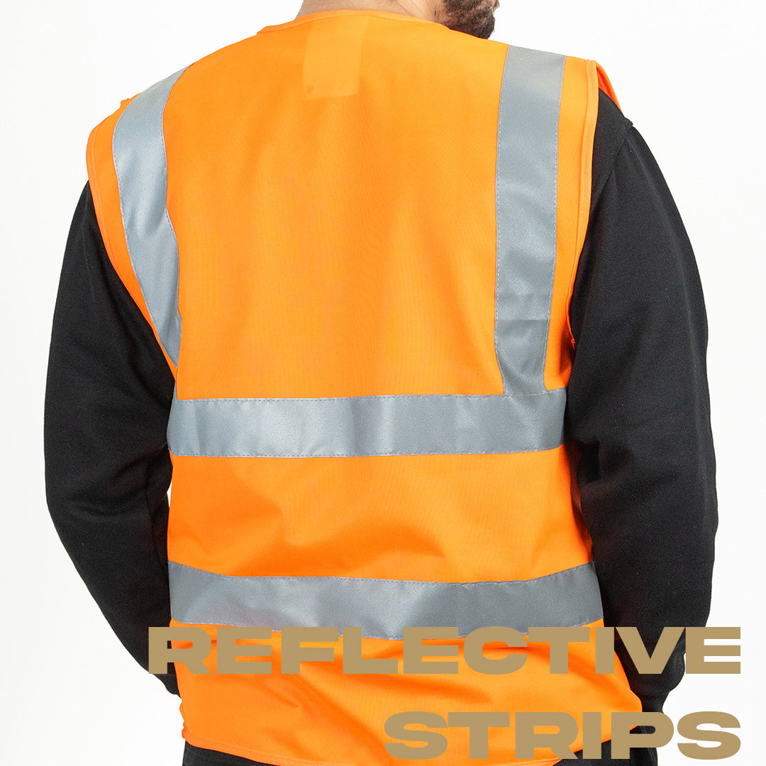 rear view of hi vis orange vest on top of black work jumper