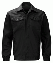 jet black utility jacket with a pointed collar, concealed front closure, dual chest flap pockets, and elastic cuffs, built for clean structure and everyday resilience by MAK Boots & Garments.